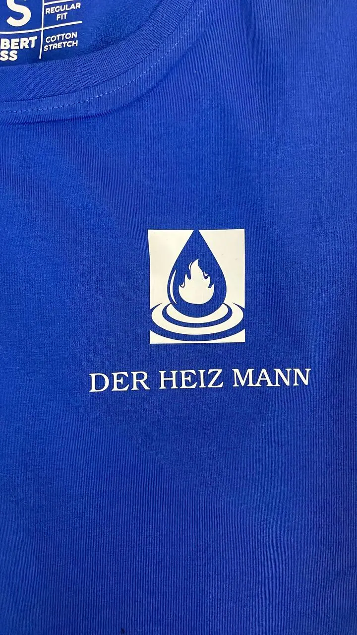 Der Heiz Mann Firmenlogo auf Arbeitskleidung